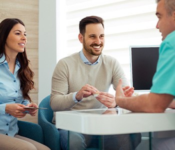 Couple consults with dentist