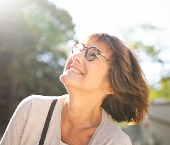 Lady smiles at the sky