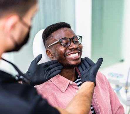 Man smiling at the dentist