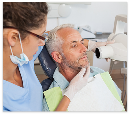 Dental patient having x rays of his mouth taken