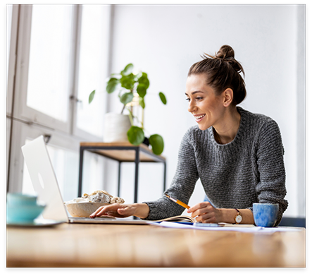 Woman scrolling on her laptop