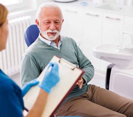 Patient and dental team member talking during consultation