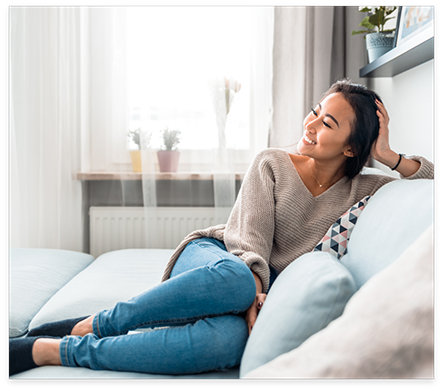 Smiling woman sitting on couch