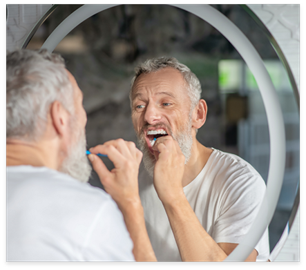 Senior man brushing his teeth
