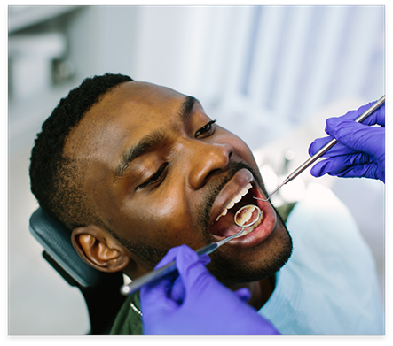 Man receiving a preventive dental checkup in Nocatee