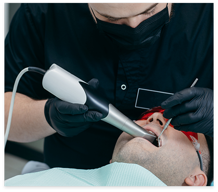 Dental patient receiving an oral cancer screening