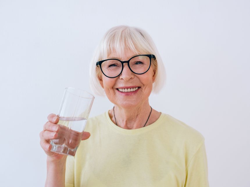 A woman drinking a glass of water